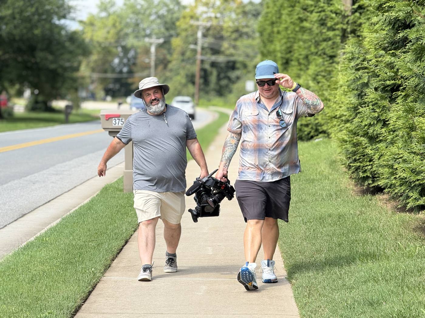 Eric Dowdy and Jeff Irvin walking with the camera